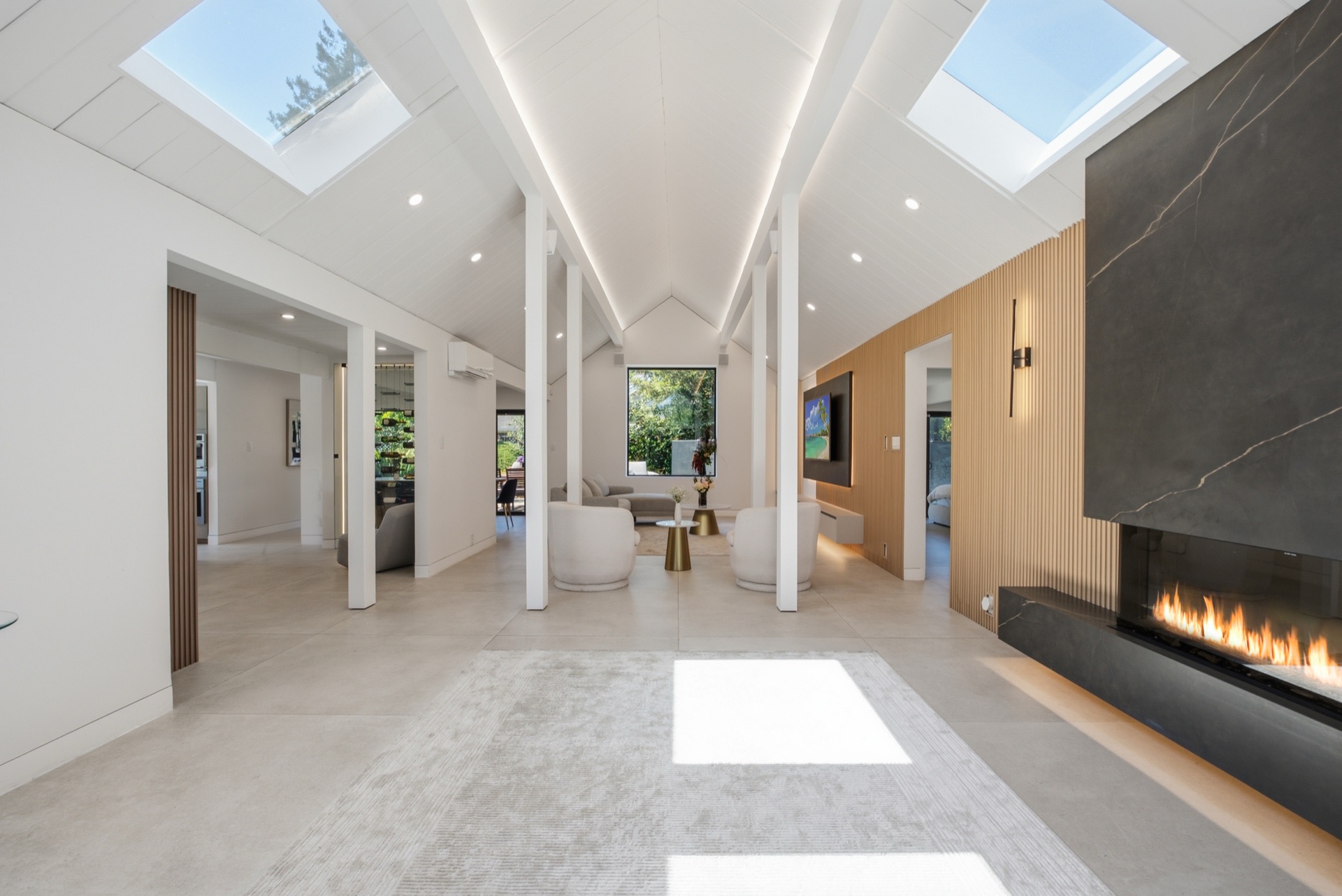 Vaulted great room with skylights and fireplace